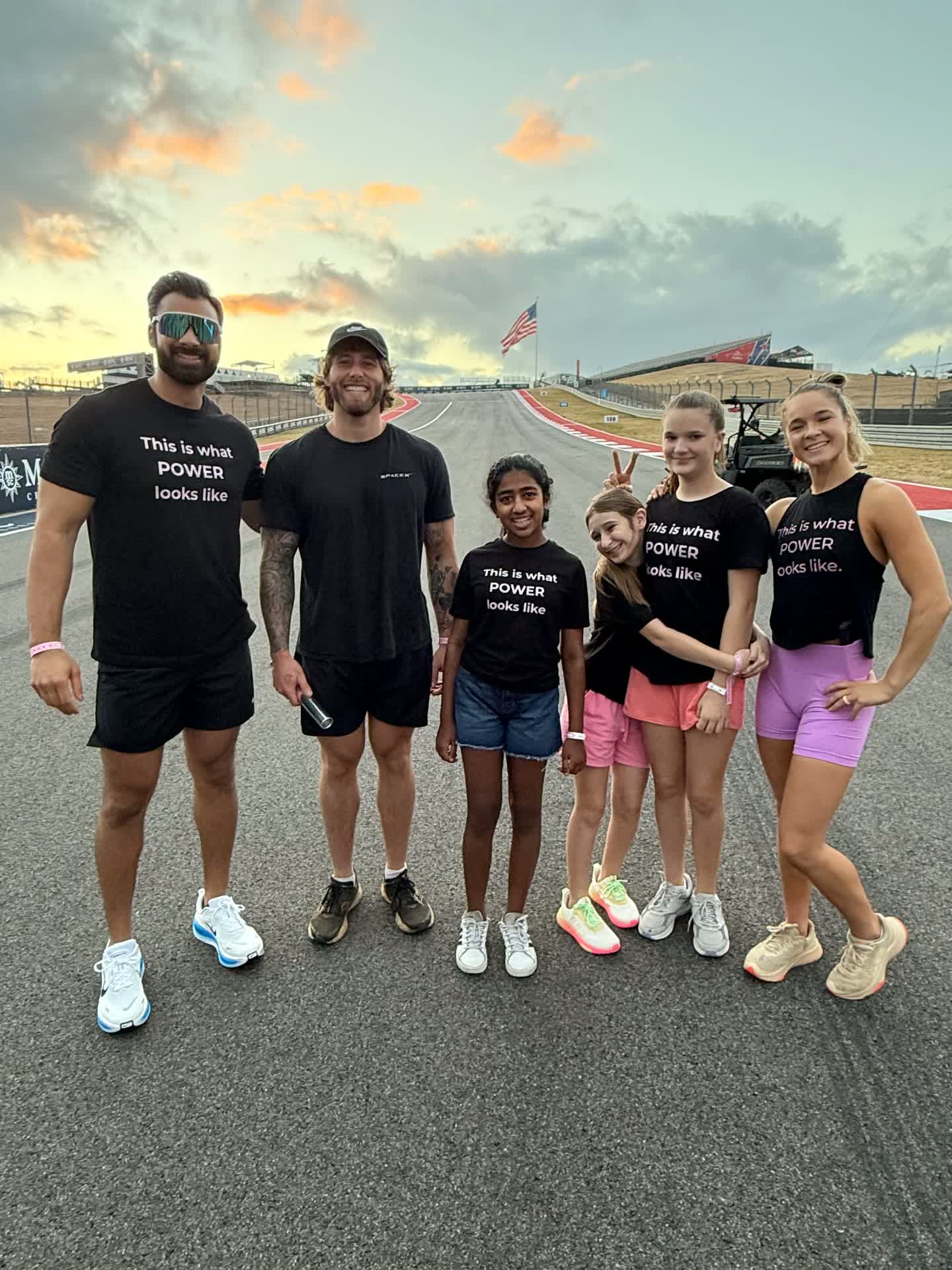 Girls and mentors on the COTA track at sunrise
